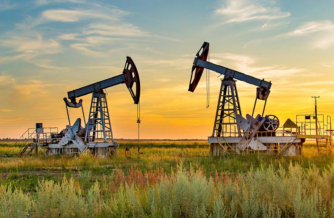 Oil field pumps at sunrise