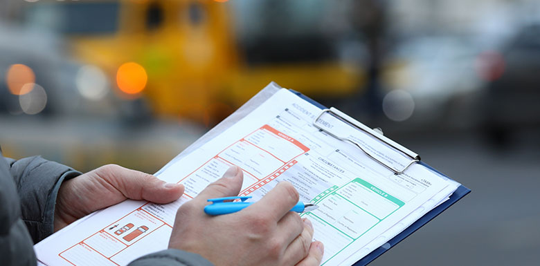 Police officer filling out a crash report in Texas